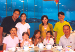Photo of the Yeung's Family - (front row, from left to right) Yeung's wife, Yeung's granddaughter, Yeung's elder daughter, Yeung's granddaughter, Yeung, (2nd Row, from left to right) Yeung's son, Yeung's daugther-in-law, Yeung's younger daughter and Yeung's son-in-law